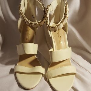 Cream heels with gold accents